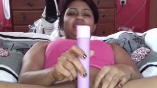 Pakistani beauty using a long plastic dildo sex toy to masturbate