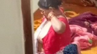 Aunty caught on hidden cam while dressing video