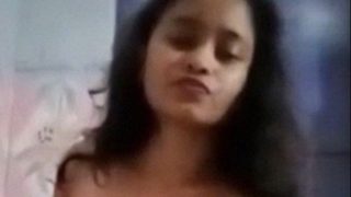 Cute Indian girl masturbating using dildo in the bathroom