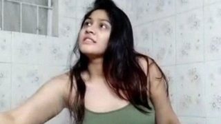 Wet sexy boobed desi girl in green top dancing in the bath